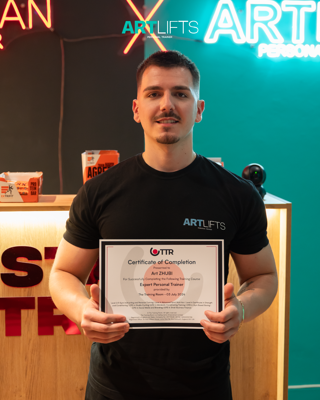 Art Zhubi holding The Training Room UK Certificate